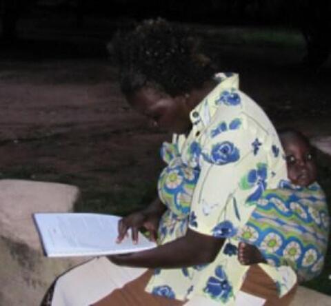 Woman Reading with Baby Woman Reading with Baby